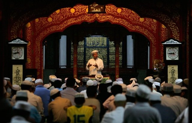 Muslims attend Friday prayers on the first day of the holy month of Ramadan at a mosque in Beijing, China on August 21, 2009.