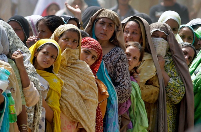 Pakistani women line up for subsidized sacks of flour provided by the government for the holy month of Ramadan, Saturday, Aug. 22, 2009 in Rawalpindi, Pakistan. 