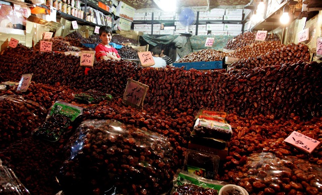 A boy sells dates in Amman, Jordan on Saturday August 22 2009.