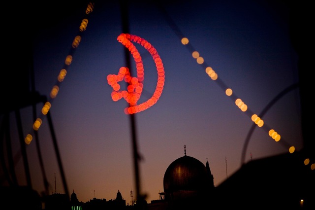 The Dome of the Rock, or Masjid Qubbat As-Sakhrah, one of the holiest sites in Islam, is seen on the Temple Mount in Jerusalem through festive lights for Ramadan on Tuesday, Aug. 25, 2009.